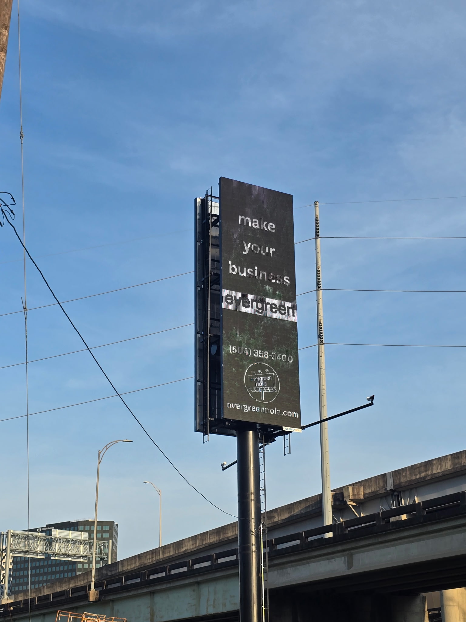 The I-10 digital billboard displaying an ad reading make your business evergreen